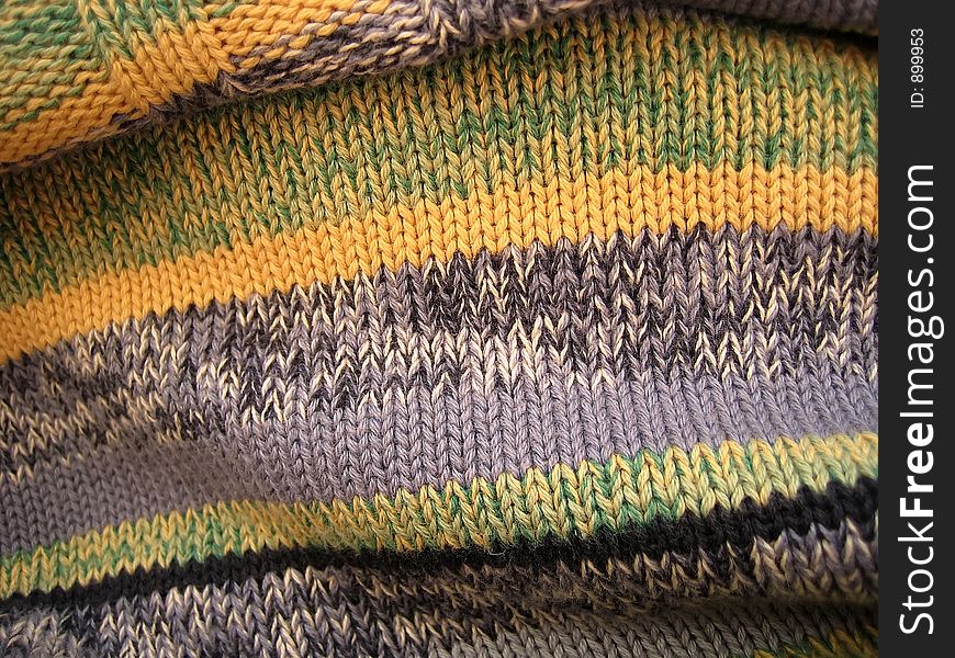 Woolen sweater from the threads of different colors.