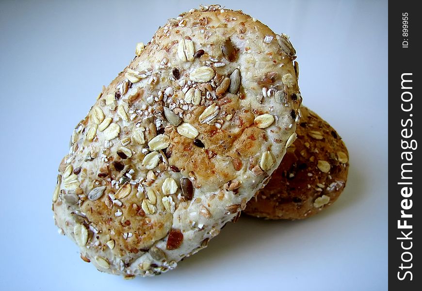 Bread with grain on blue background.