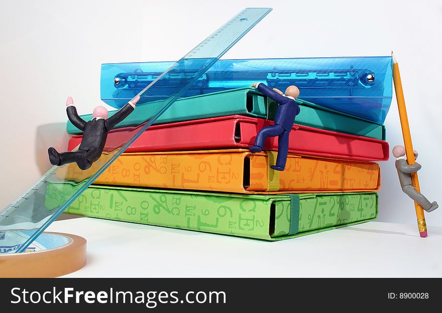 Plasticine human figures humorously handling office objects on white background. Plasticine human figures humorously handling office objects on white background