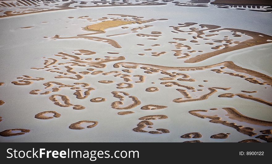 Oyster beds exposed during near low tide in estuary along the South Carolina Atlantic coast