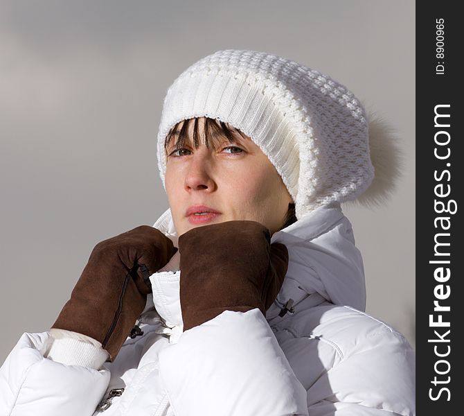 Winter portrait of a serious girl in leather gloves. Winter portrait of a serious girl in leather gloves