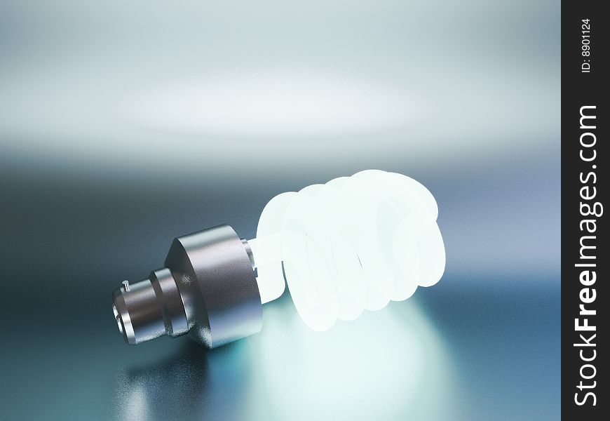 One eco-friendly bulb laying on steel background. One eco-friendly bulb laying on steel background