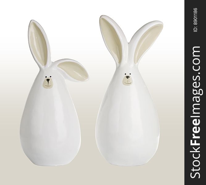 Sculpture of two rabbits isolated on white