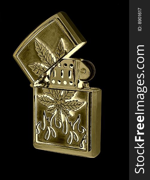 Beautiful gold petrol lighter on a black background