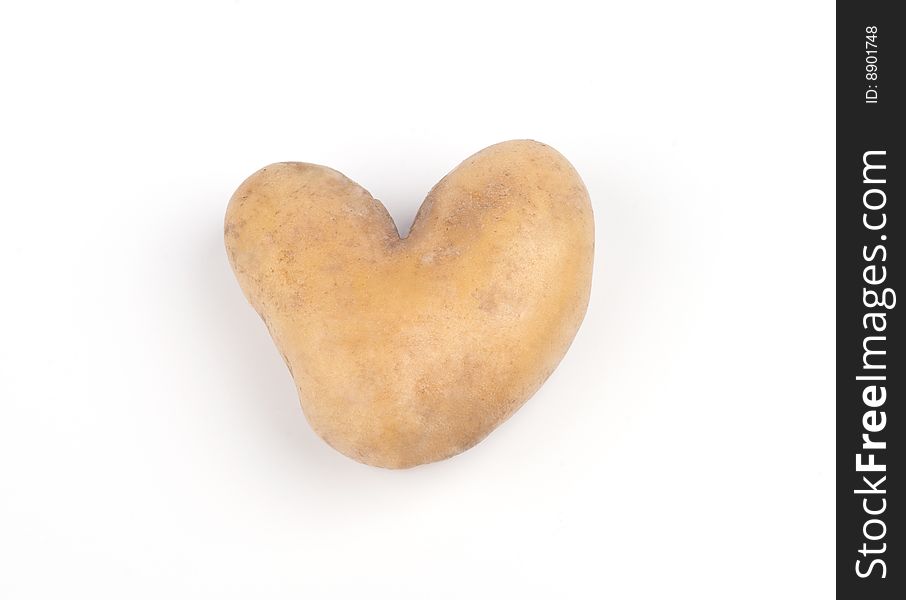 Heart shaped potato on a white background