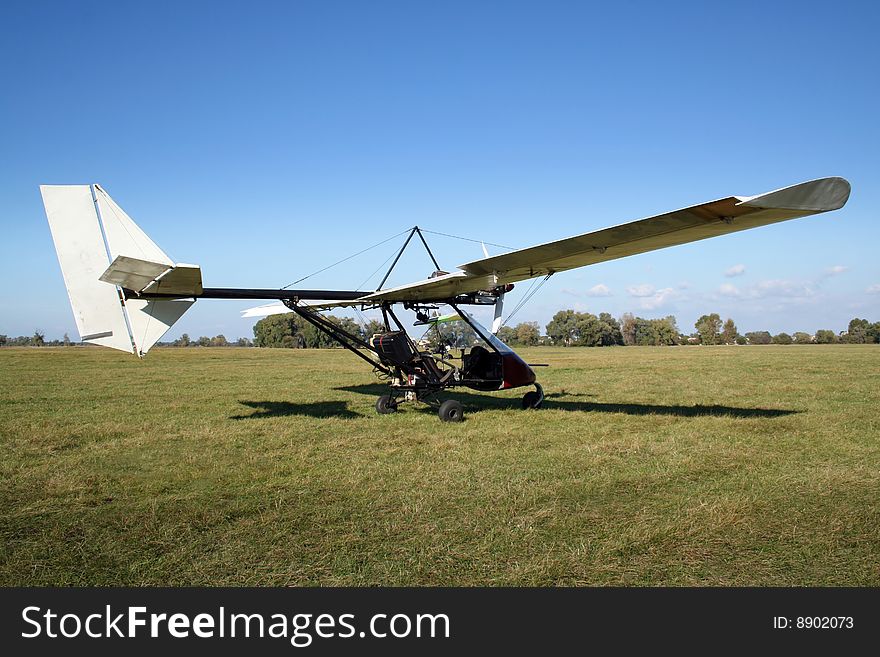 White microlight after landing on the field. White microlight after landing on the field