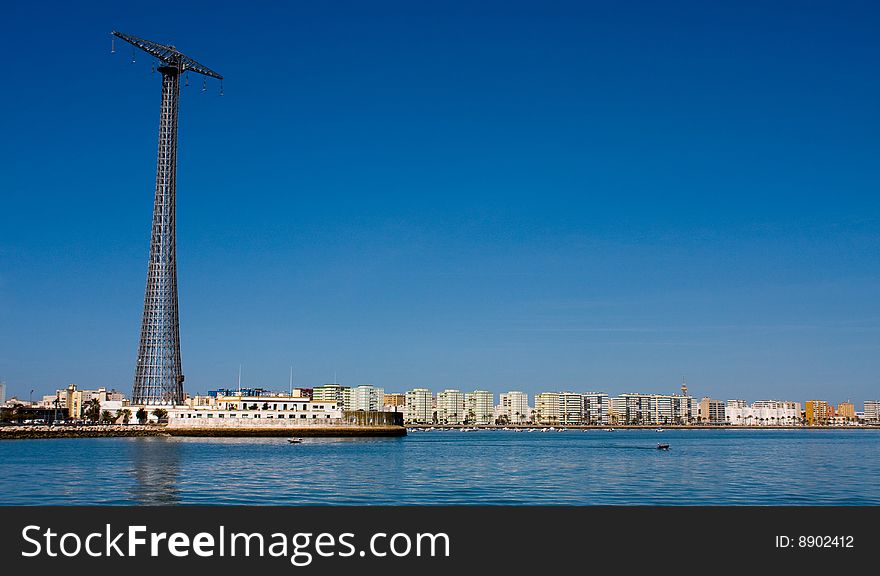 Large Steel structure carries power lines across the bay of Cadiz in Spain, which can be seen in the background. Large Steel structure carries power lines across the bay of Cadiz in Spain, which can be seen in the background