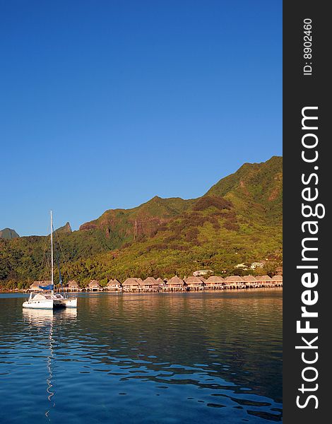 Sail boat at anchor in a lagoon