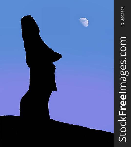 A silhouette of a stone statues on Easter Island