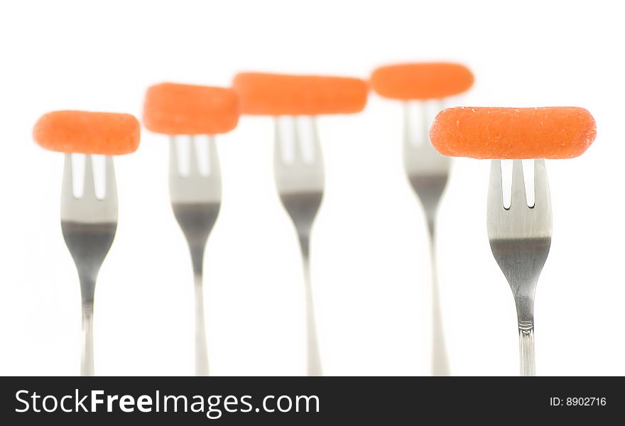 Composition of carrots and forks with blur DOF effects. Composition of carrots and forks with blur DOF effects