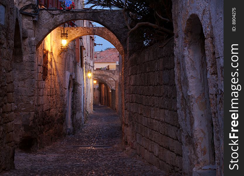 An alley in Rhodes, Greece, shot just before sunrise. An alley in Rhodes, Greece, shot just before sunrise.