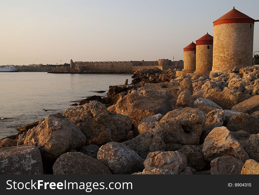 The Moles (bases) of Medieval Windmills, Rhodes, Greece, captured at sunrise. The Moles (bases) of Medieval Windmills, Rhodes, Greece, captured at sunrise