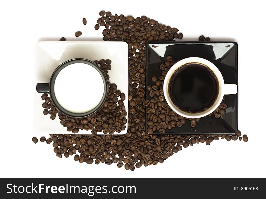 A lovely set of a coffee mug and coffee beads, isolated on a white background, viewed from above.