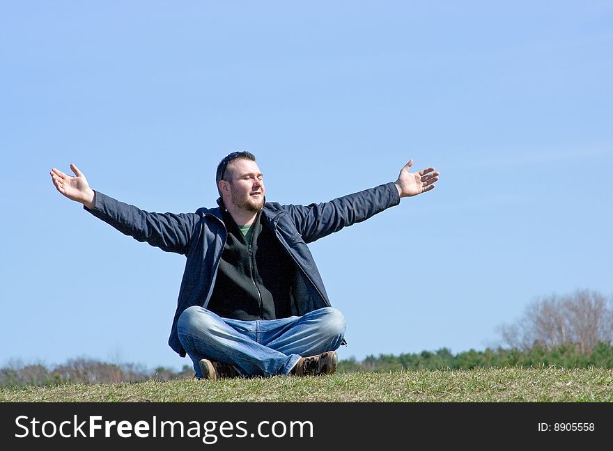 Happy young man on meadow