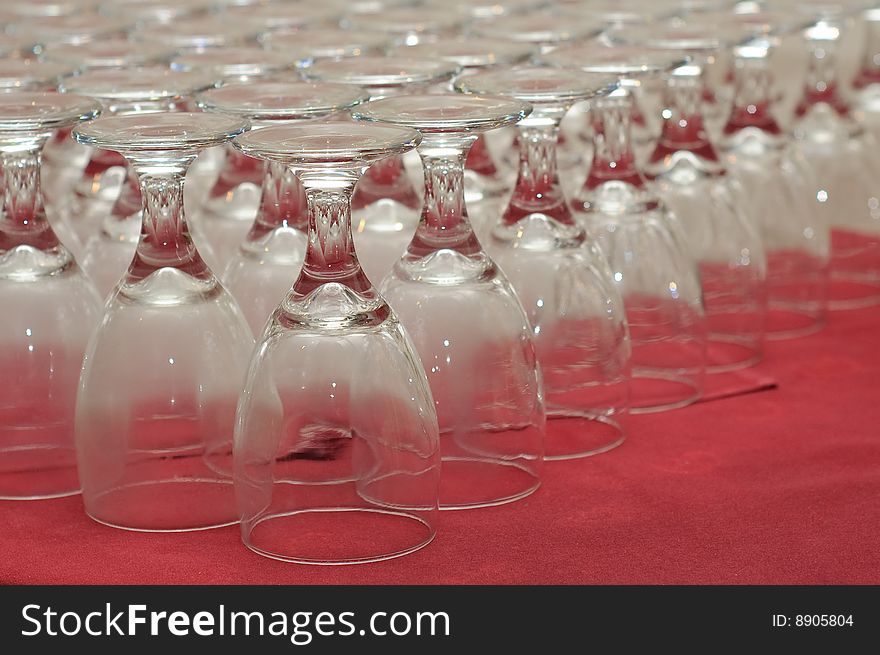 Closeup of rows of inverted glasses