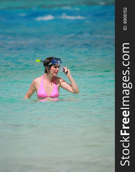 Woman in water with mask and snorkel
