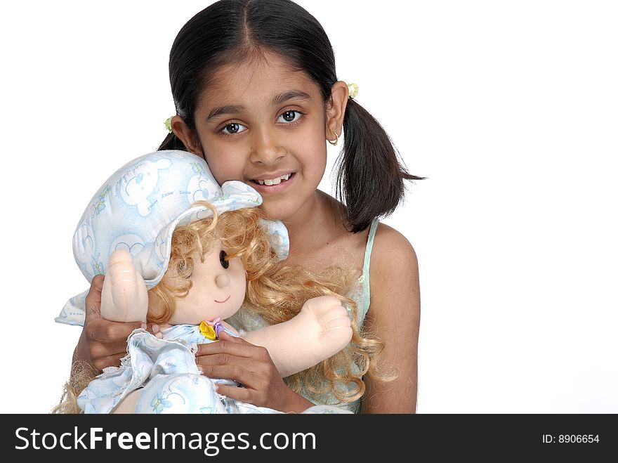 Girl holding pretty doll