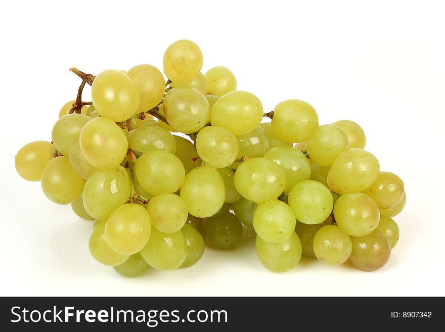 Green grapes on a white background. Green grapes on a white background