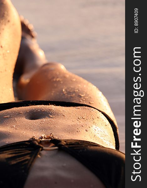 Shot of woman in black bikinis on the beach. Shot of woman in black bikinis on the beach