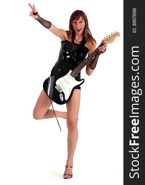 Woman in patent leather posing with electric guitar. Woman in patent leather posing with electric guitar