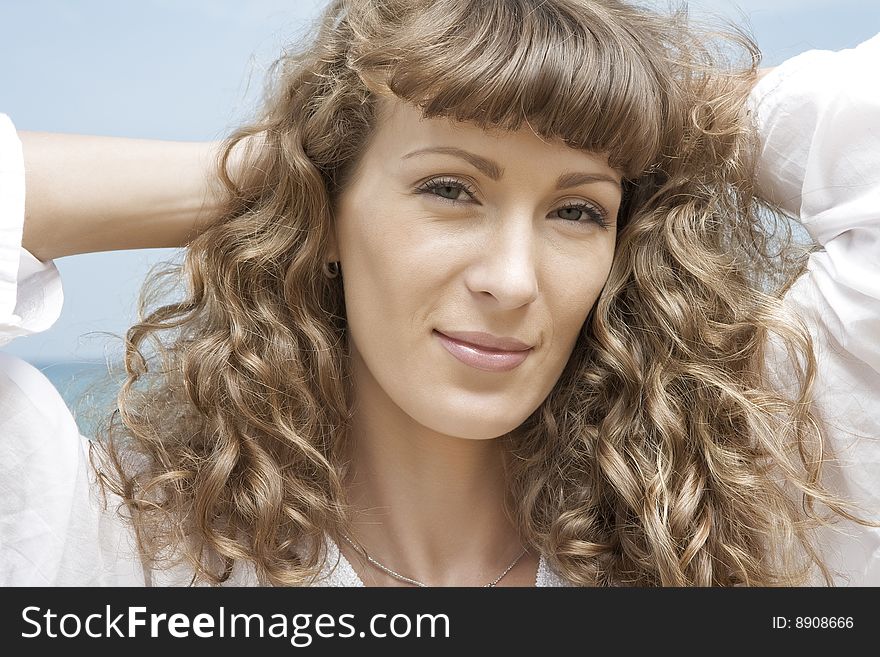 Portrait of nice young woman having good time on the beach. Portrait of nice young woman having good time on the beach