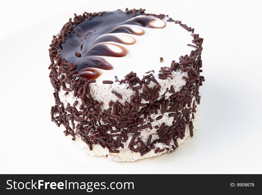 The beauty chocolatecake isolated on whine background. The beauty chocolatecake isolated on whine background