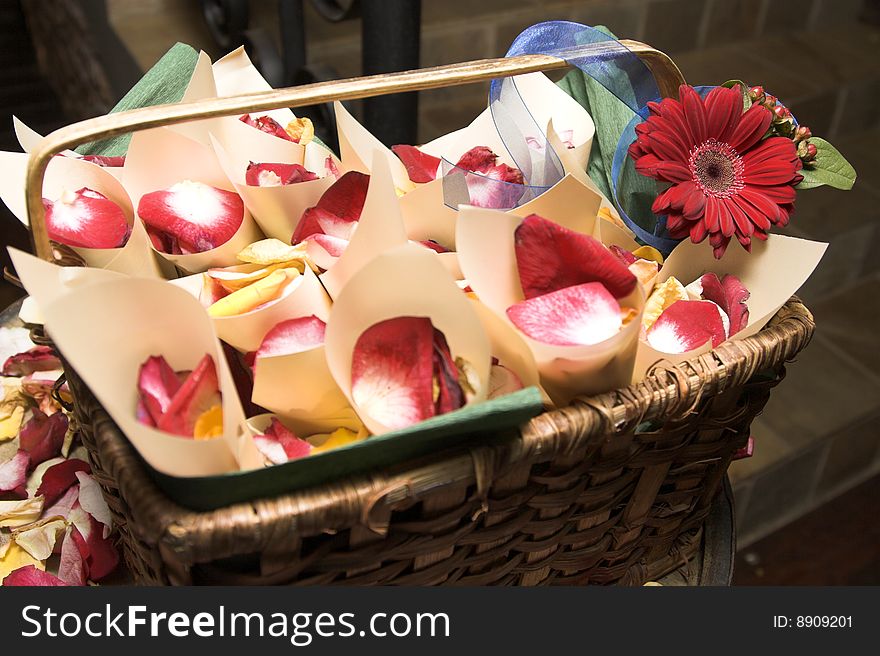 Basket containing cones filled with petals at a wedding. Basket containing cones filled with petals at a wedding
