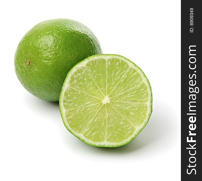 Two limes on white background.