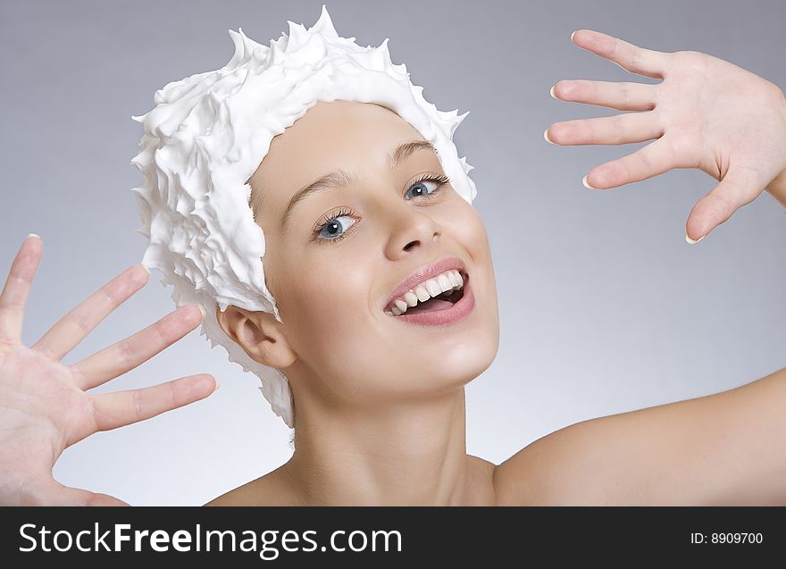 High key portrait of young woman on gray  back. High key portrait of young woman on gray  back