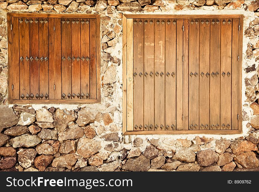 Rustic wall with two windows