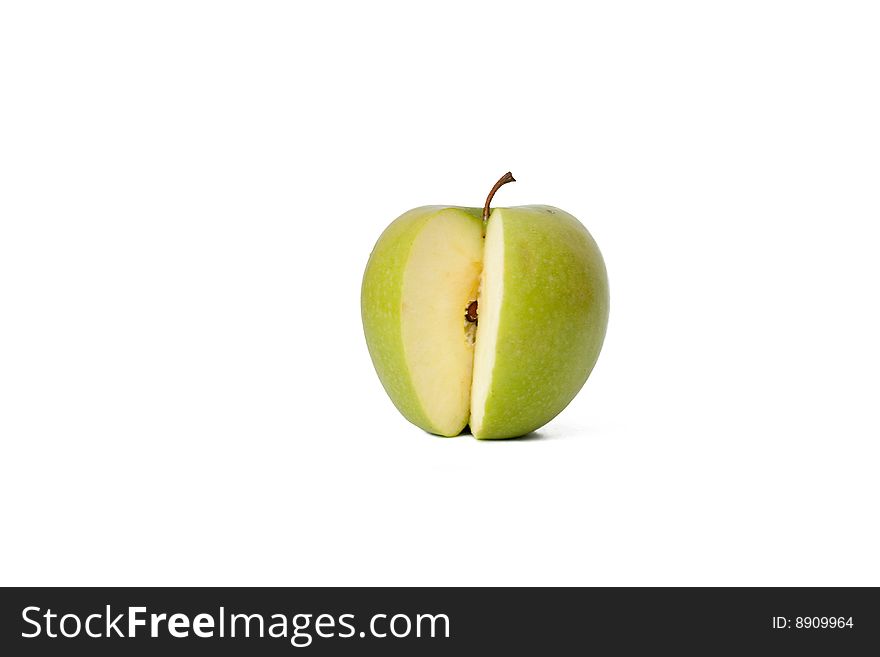 The green cut off apple on a white background