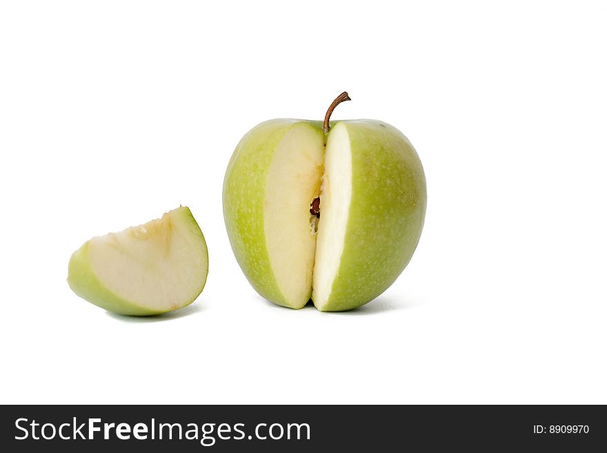 The green cut off apple on a white background