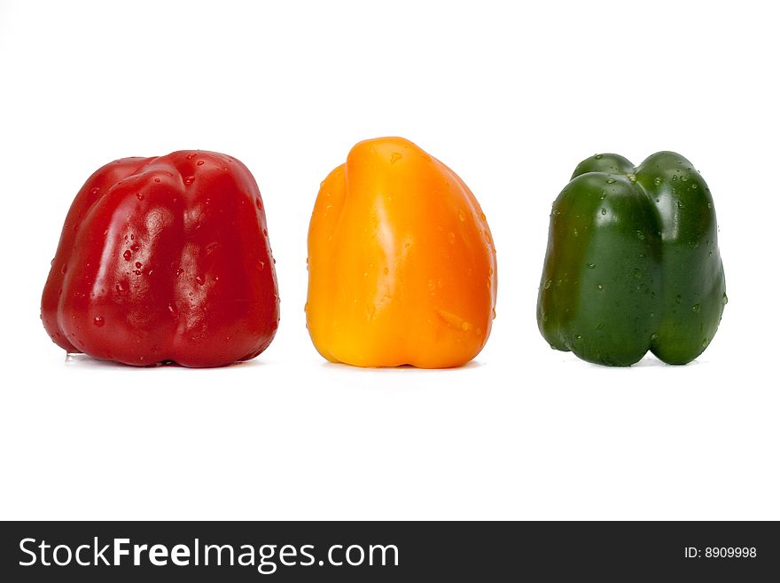 Three color sweet pepper on a white background