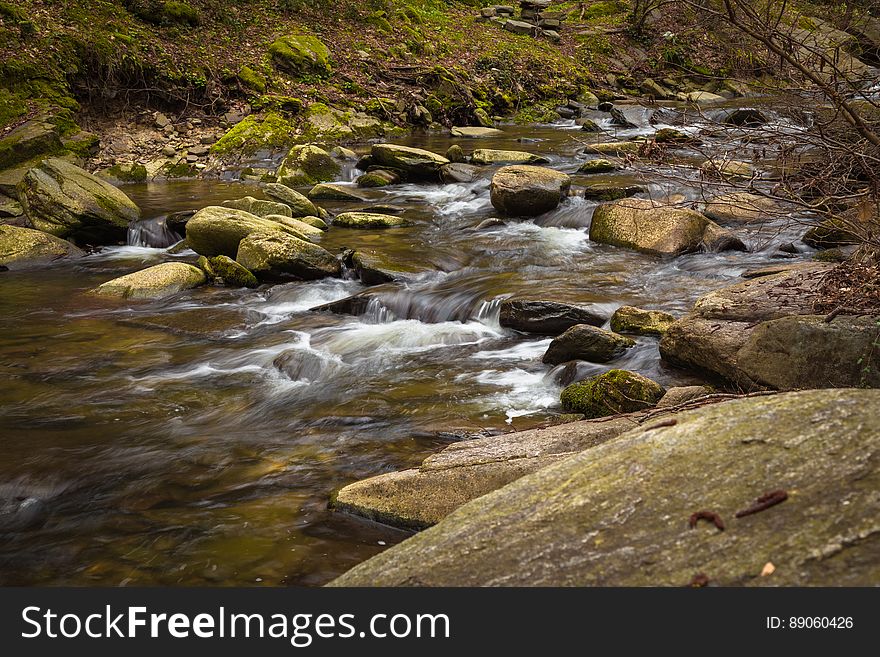 A river passing through a rocky stream. A river passing through a rocky stream.