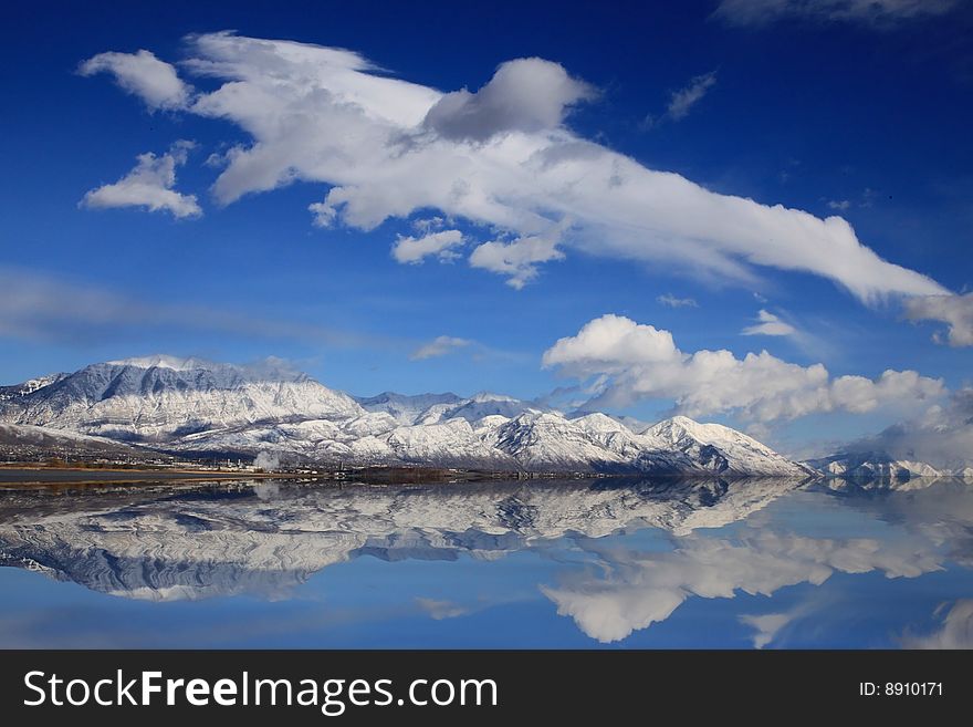 Lake in the spring with snow capped Mountains. Lake in the spring with snow capped Mountains