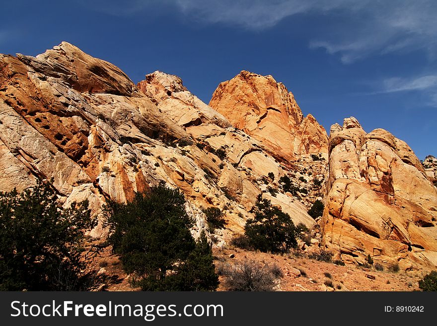 View of red rock formations in San Rafael Swell with blue skyï¿½s