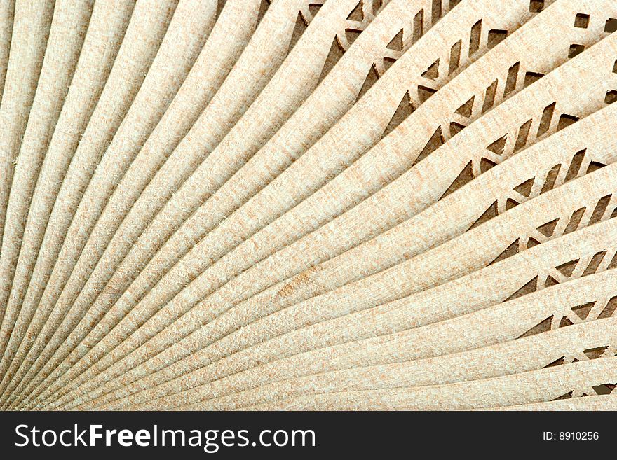 Decorative wooden Japanese fan with ornament