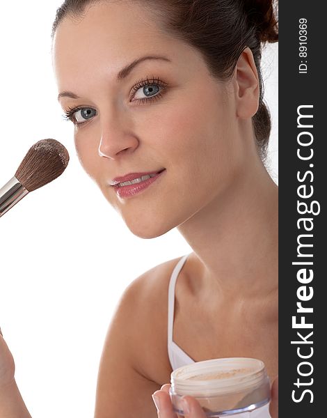 Body care - Young woman with make-up brush on white background