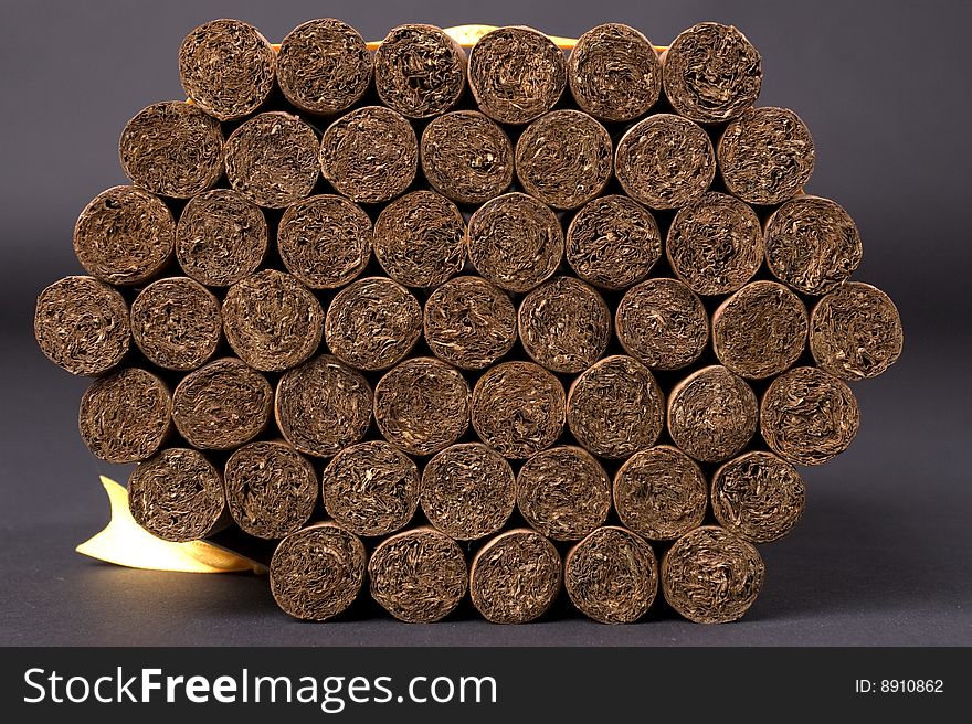50 Bolivar Colosales cigars with black background