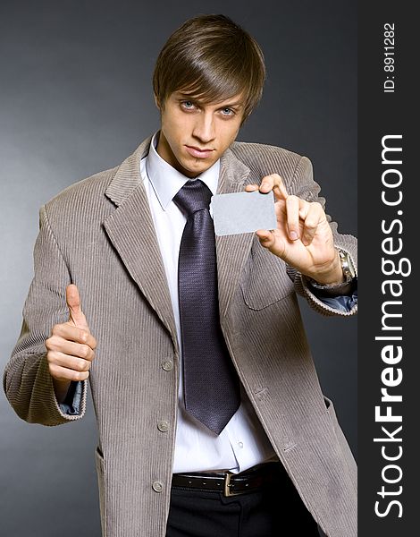 Businessman showing a blank card ok sign. Businessman showing a blank card ok sign