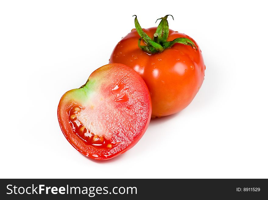 Fresh tomato and its half cut  isolated on white background