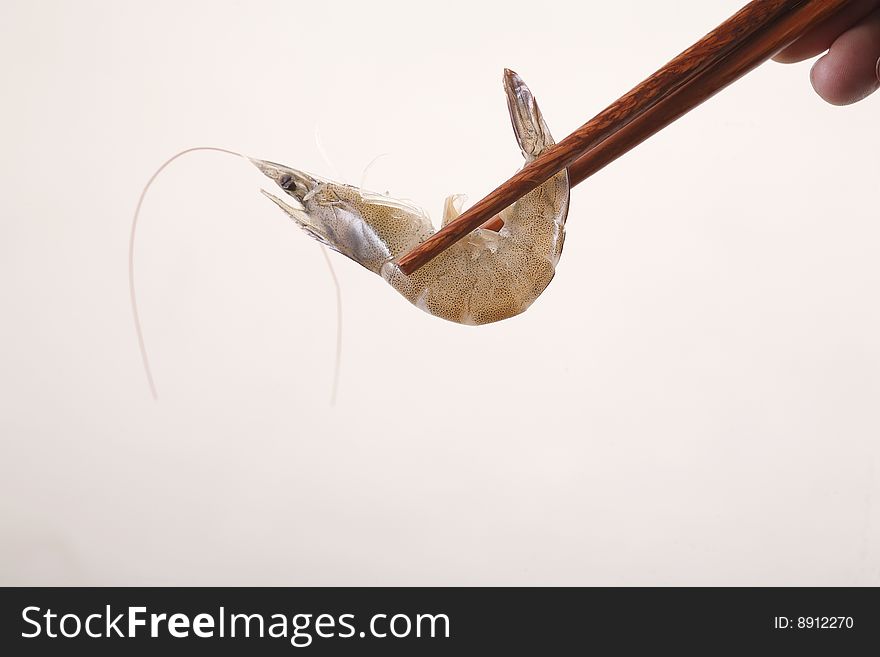 A chopsticks with shrimp