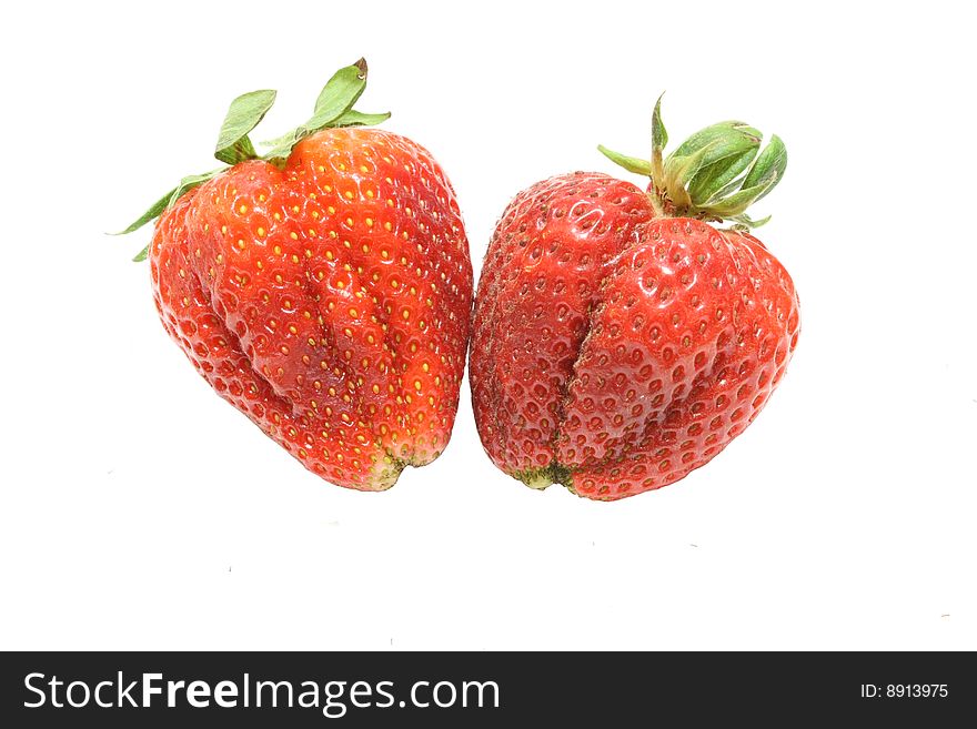 Two strawberries isolated over white