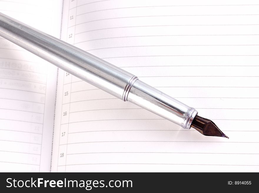 Metallic pen on a white background