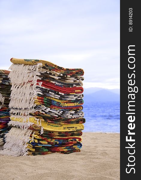 Mexican blankets for sale on the beach.