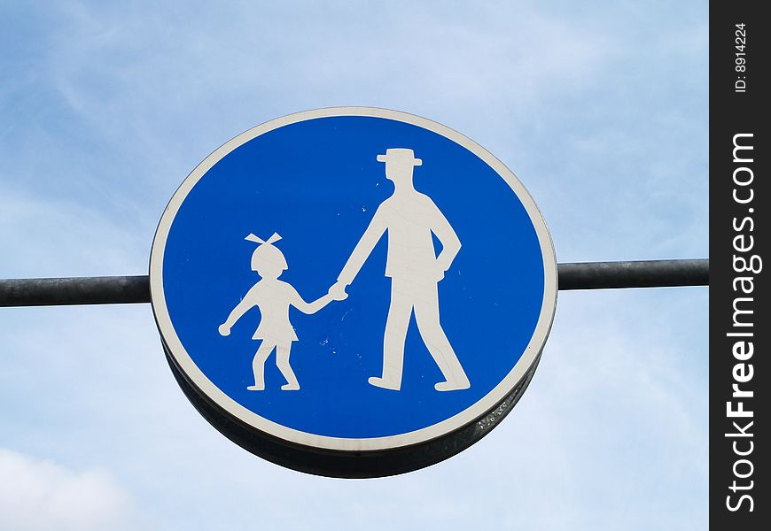 Blue rounded pedestrian path sign