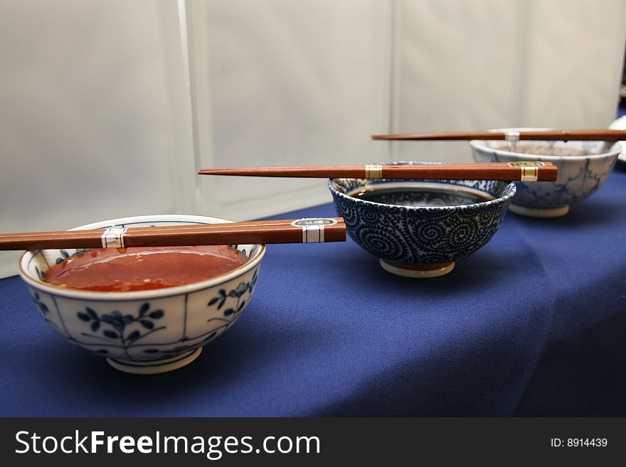 Sweet chilli and soya sauce dippers in china bowls with blue flower motivs. Sweet chilli and soya sauce dippers in china bowls with blue flower motivs