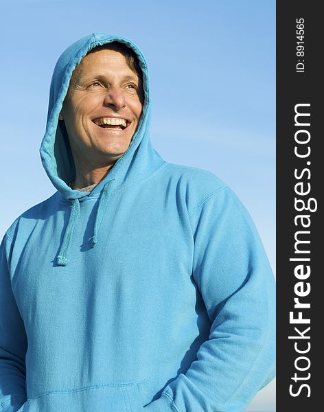 A happy smiling forties man having fun on the beach. A happy smiling forties man having fun on the beach.