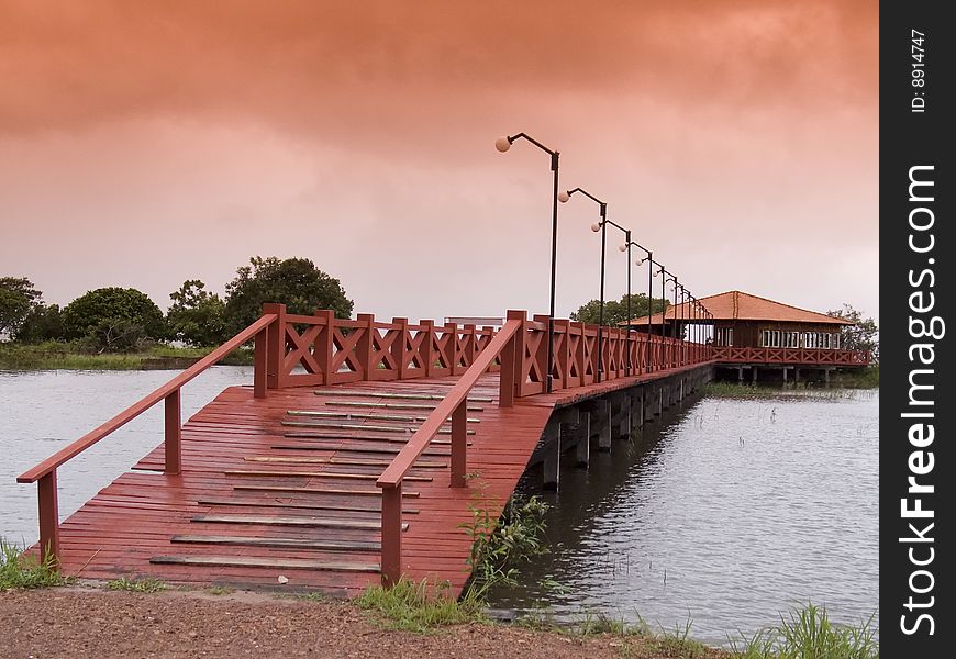 Red wooden bridge at sunset - Amazonia - Brazil