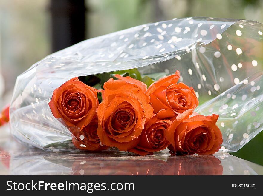 Bouquet of red roses on a marble slab